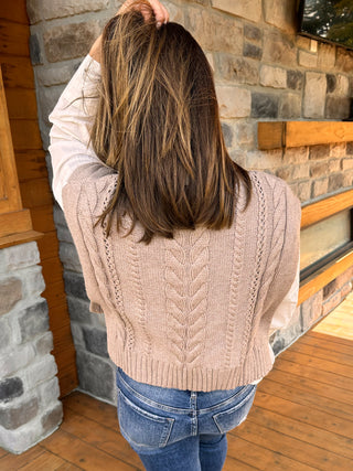 Oat sweater vest with cable detail and open sides