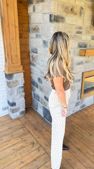 Ivory high waisted corduroy pants with light olive vintage floral pattern