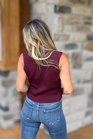 burgundy sweater vest top with flyaway front and gold tone hardware