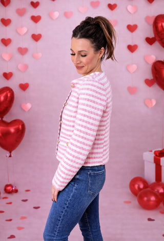 The Pink Lady Jacket featuring classic pink stripes and gold buttons